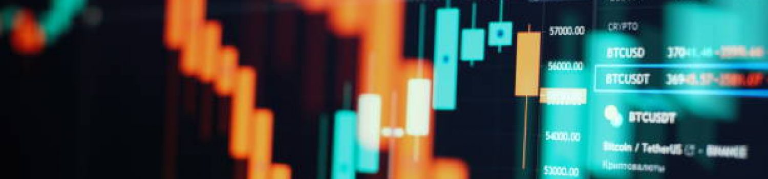 Charts of financial instruments with various type of indicators including volume analysis for professional technical analysis on the monitor of a computer.